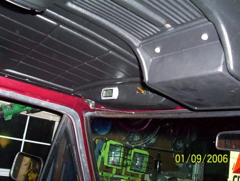 1979 Ford Bronco - The interior of a vehicle shows a digital clock displaying 7:42, with a date stamp from 2006.