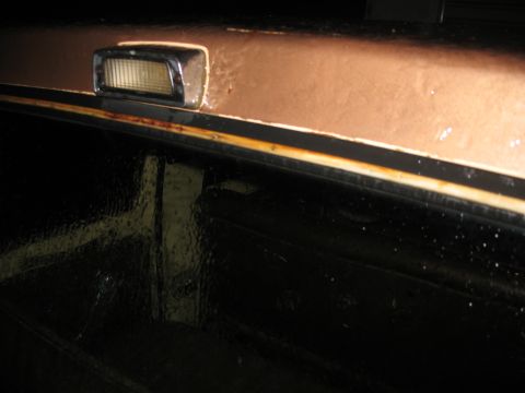 1978 Ford F-250 - The side marker light and trim on the 1978 Ford F-250 show signs of rust and wear.