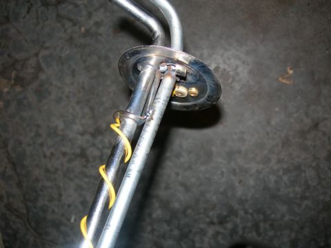 1984 Ford Bronco - Close-up of a fuel sending unit, possibly for a classic vehicle.