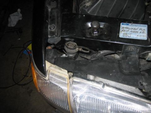 1996 Ford Thunderbird - Close-up view of a vehicle's engine bay, a sticker with a date of 4-17-95.