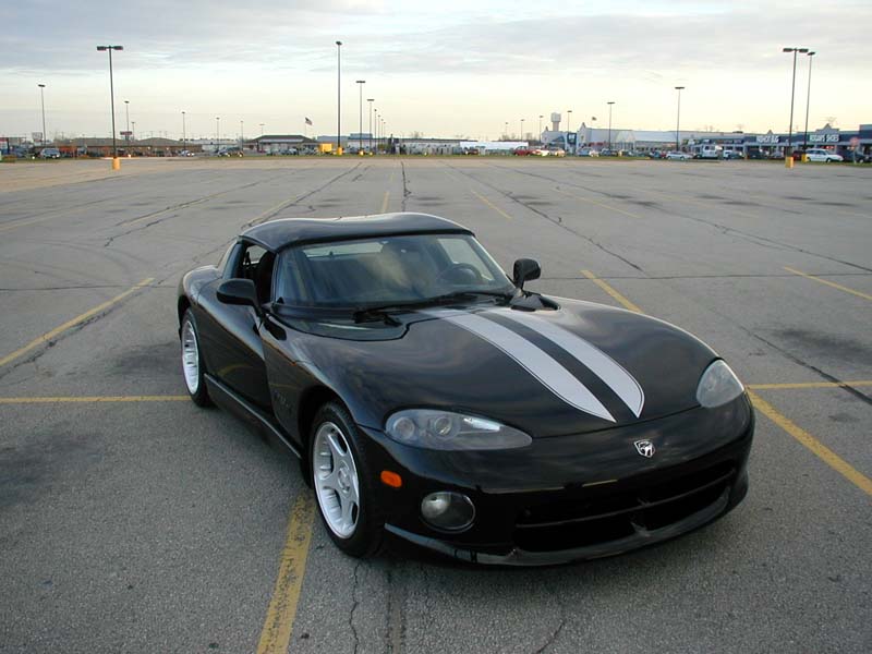 Black 1996 Dodge Viper with twin silver racing stripes on the hood and trunk
