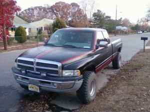 1996 Dodge 1500 - This 1996 Dodge 1500 pickup truck is shown from a 3/4 front angle on a residential street.
