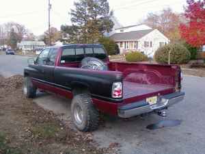 1996 Dodge 1500 - This 1996 Dodge 1500 pickup truck is seen from the rear, parked on a residential street.