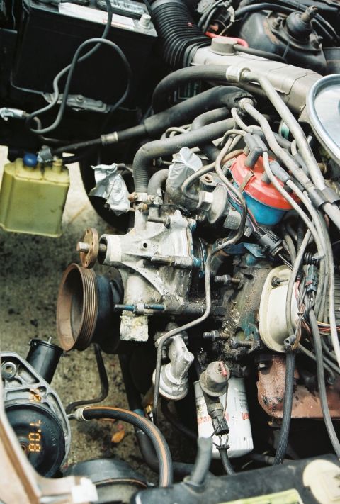 1980 Ford Mustang - Close-up of an engine bay, showing various mechanical components and a digital gauge reading.