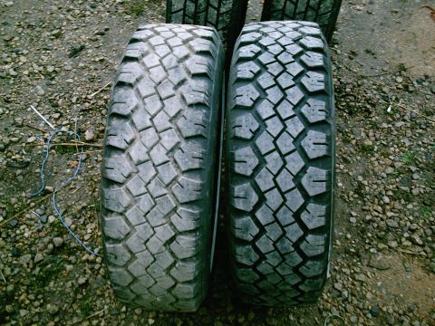 2001 Dodge 2500 - Two off-road tires are shown side-by-side, displaying their distinct tread designs.
