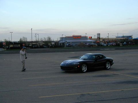 1996 Dodge Viper - A black 1996 Dodge Viper is parked in an empty lot during the day.