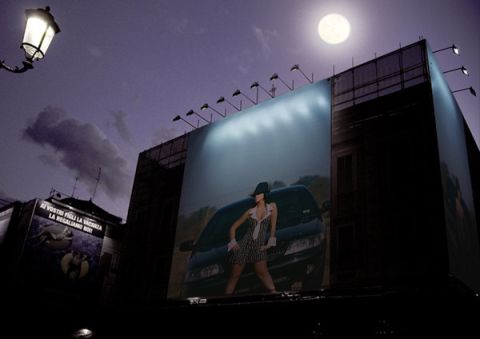 2003 Mercury Marauder - A woman poses with a car on a large billboard under a full moon.