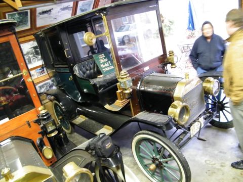 1909 Ford Model T - 1912 town car on right. 1914 town car on left