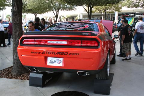 1998 Ford Crown Victoria - Rear view of an orange Dodge Challenger SRT8, a custom decal and website address on the trunk.