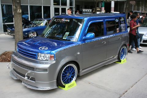 1998 Ford Crown Victoria - This customized compact van features a striking two-tone paint scheme and aftermarket wheels.