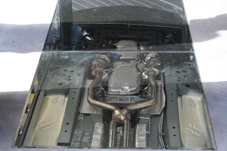 Underside view of a car's engine and exhaust system