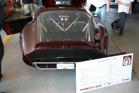 1998 Ford Crown Victoria - A custom coupe is displayed with its rear visible, showing an exposed roll cage and gauges.