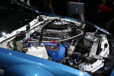 1998 Ford Crown Victoria - Custom engine bay features a prominent supercharger and various aftermarket components.