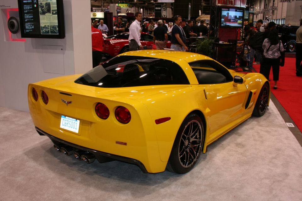 Yellow Chevrolet Corvette C6 rear view with quad exhaust and custom license plate C6R5001