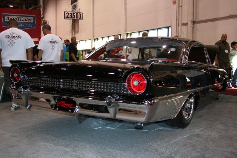 1998 Ford Crown Victoria - Rear view of a black 1959 Ford Fairlane 500 Skyliner at a car show.