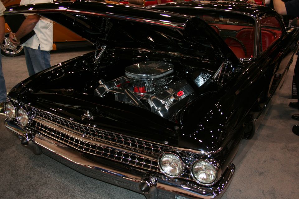 Black 1959 Ford Fairlane 500 Skyliner front view, hood open, chrome engine
