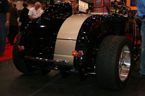1998 Ford Crown Victoria - Rear view of a custom hot rod with a distinctive black and tan paint scheme.