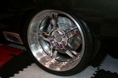 1998 Ford Crown Victoria - Custom chrome wheel and tire on a vehicle, showing aftermarket modifications.