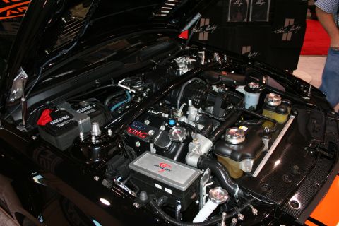 1998 Ford Crown Victoria - The engine bay features a Shelby air intake system and custom racing valve covers.