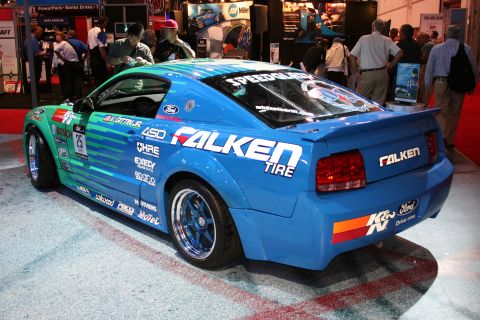 1998 Ford Crown Victoria - This modified Ford Mustang features a distinctive blue and green livery with Falken Tires branding.