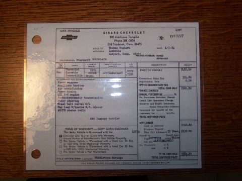 1991 Ford LTD Crown Victoria - Dealer car invoice from Girard Chevrolet listing a 1974 Corvette's equipment, pricing and terms of warranty.
