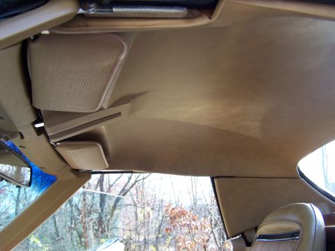 1991 Ford LTD Crown Victoria - View of the tan headliner and sun visors inside a vehicle.
