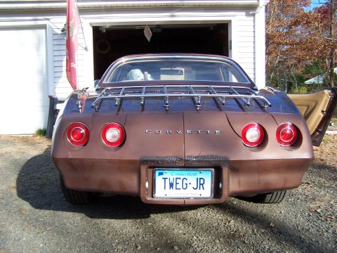 1991 Ford LTD Crown Victoria - Rear view of a brown Corvette with a luggage rack and a Connecticut license plate.