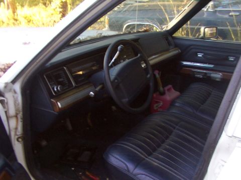 1991 Ford LTD Crown Victoria - Interior view of a 1991 Ford Crown Victoria LTD, showing the dashboard, steering wheel, and front seats.