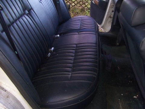 1991 Ford LTD Crown Victoria - Interior view of a car's rear seating area, showing dark upholstery.