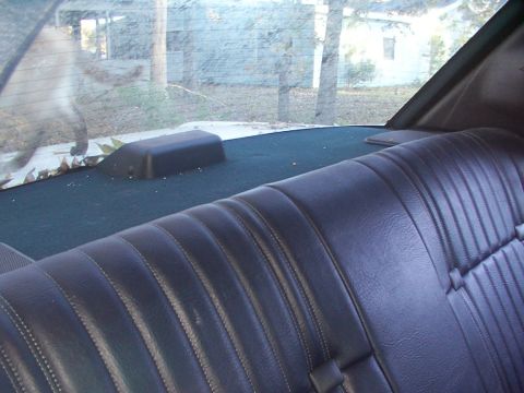 1991 Ford LTD Crown Victoria - A close-up view of the interior of a car, focusing on the passenger seat and dashboard.