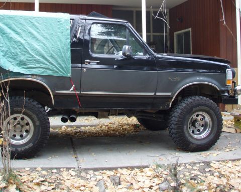 1992 Ford Bronco - passenger side view,