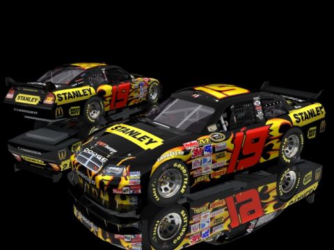 2004 Jeep Wrangler - Two Dodge Chargers, numbered 19 and 12, are displayed with a black and yellow flame livery and numerous sponsor decals.