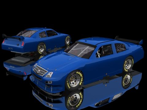 2004 Jeep Wrangler - Two blue Cadillac race cars are displayed on a reflective black surface against a black background.