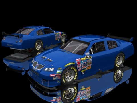 2004 Jeep Wrangler - Two blue Pontiac race cars are shown with numerous sponsor decals on their sides and hoods against a black background.