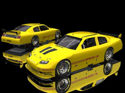 2004 Jeep Wrangler - A pair of yellow IROC-Z race cars are displayed against a black background, with one car slightly behind the other.