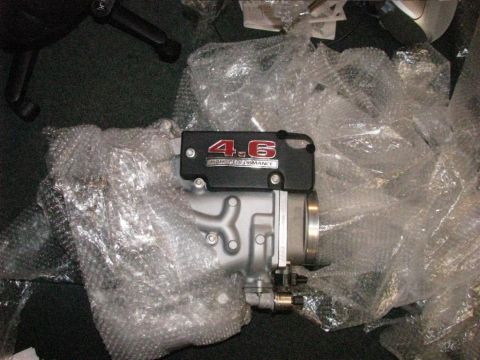 2003 Mercury Marauder - A "4.6 HIGH PERFORMANCE" engine intake part is shown, wrapped in protective bubble wrap.