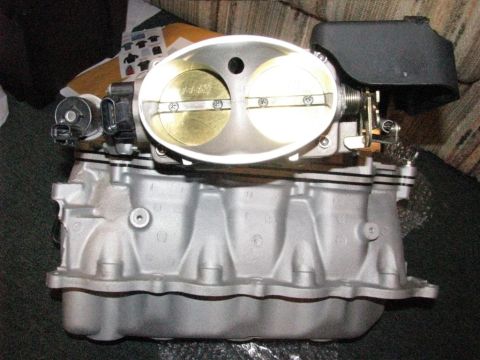 2003 Mercury Marauder - Close-up of an engine intake manifold and throttle body assembly.