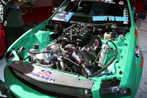 1998 Ford Crown Victoria - Customized Ford engine bay with racing decals and 'Ready to Rock' windshield sticker.