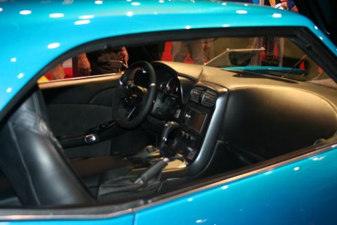 1998 Ford Crown Victoria - Custom interior of a blue vehicle, aftermarket steering wheel and console modifications.