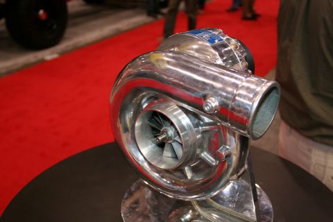 1998 Ford Crown Victoria - Close-up of a shiny turbocharger, a component used to increase engine power.