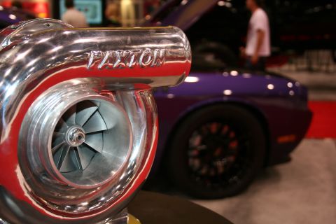 1998 Ford Crown Victoria - Close-up of a chrome Paxton turbocharger with a purple vehicle visible behind it.