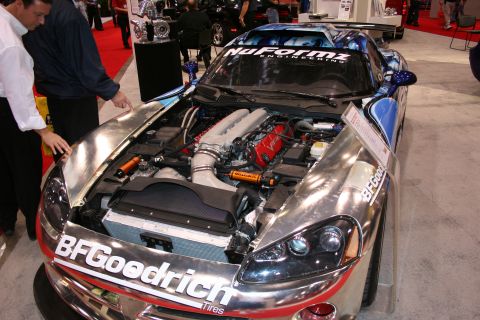 1998 Ford Crown Victoria - Dodge Viper at an auto show, engine compartment fully visible with custom graphics on the roof.