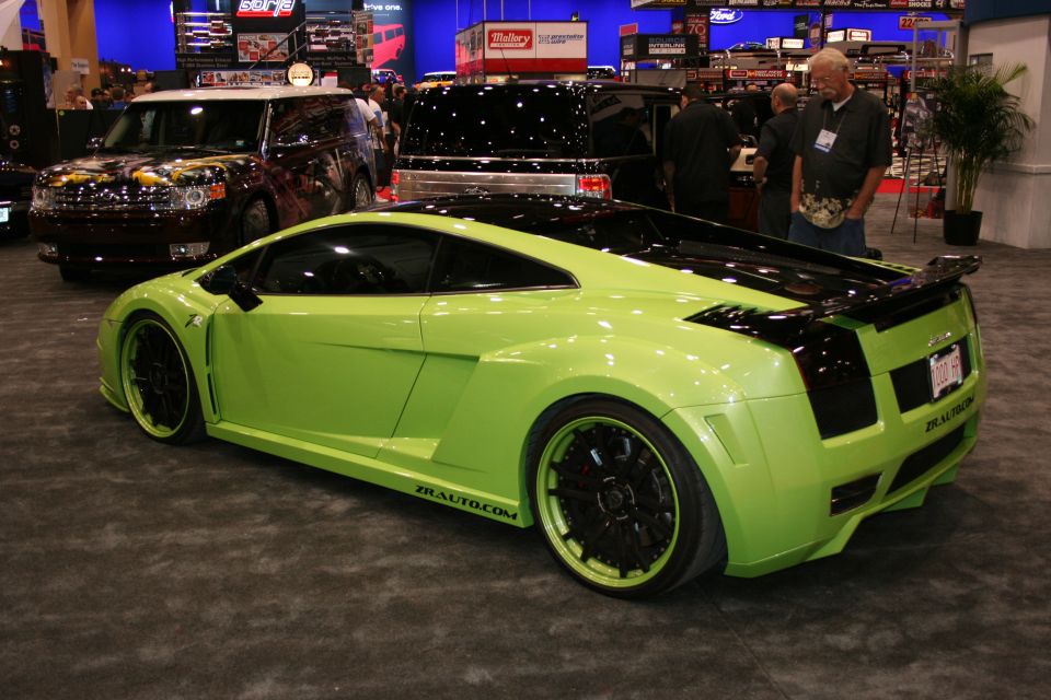 Lime green sports car with black accents and custom wheels. Text on the side reads "ZRAUTO.COM"