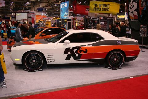 1998 Ford Crown Victoria - A customized Dodge Challenger is displayed at an automotive show, prominent K&N branding and racing stripes.