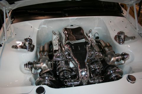 1998 Ford Crown Victoria - Highly customized engine bay with polished chrome components and twin turbochargers.