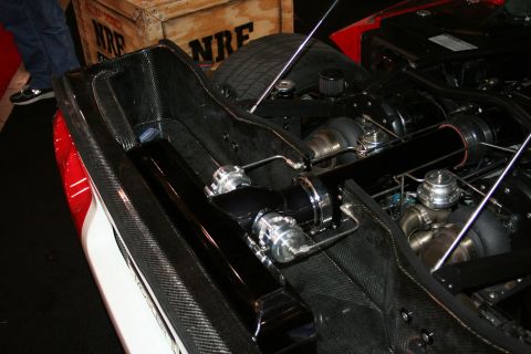 1998 Ford Crown Victoria - Custom engine bay with twin turbos and intercooler piping, partially covered in carbon fiber.