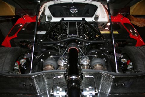 1998 Ford Crown Victoria - Close-up view of a powerful twin-turbocharged V12 engine bay.
