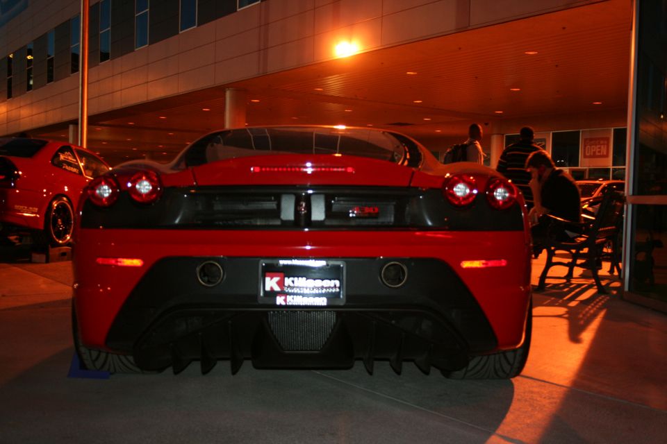Red Ferrari F430 rear view, black diffuser, dual exhaust, license plate frame from Killeen
