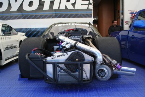 1998 Ford Crown Victoria - Drag racing car's custom engine setup with twin turbochargers and wide rear tires is visible.