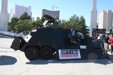 1998 Ford Crown Victoria - This heavily modified vehicle, branded with Optima Batteries, features a plow and a defensive turret.